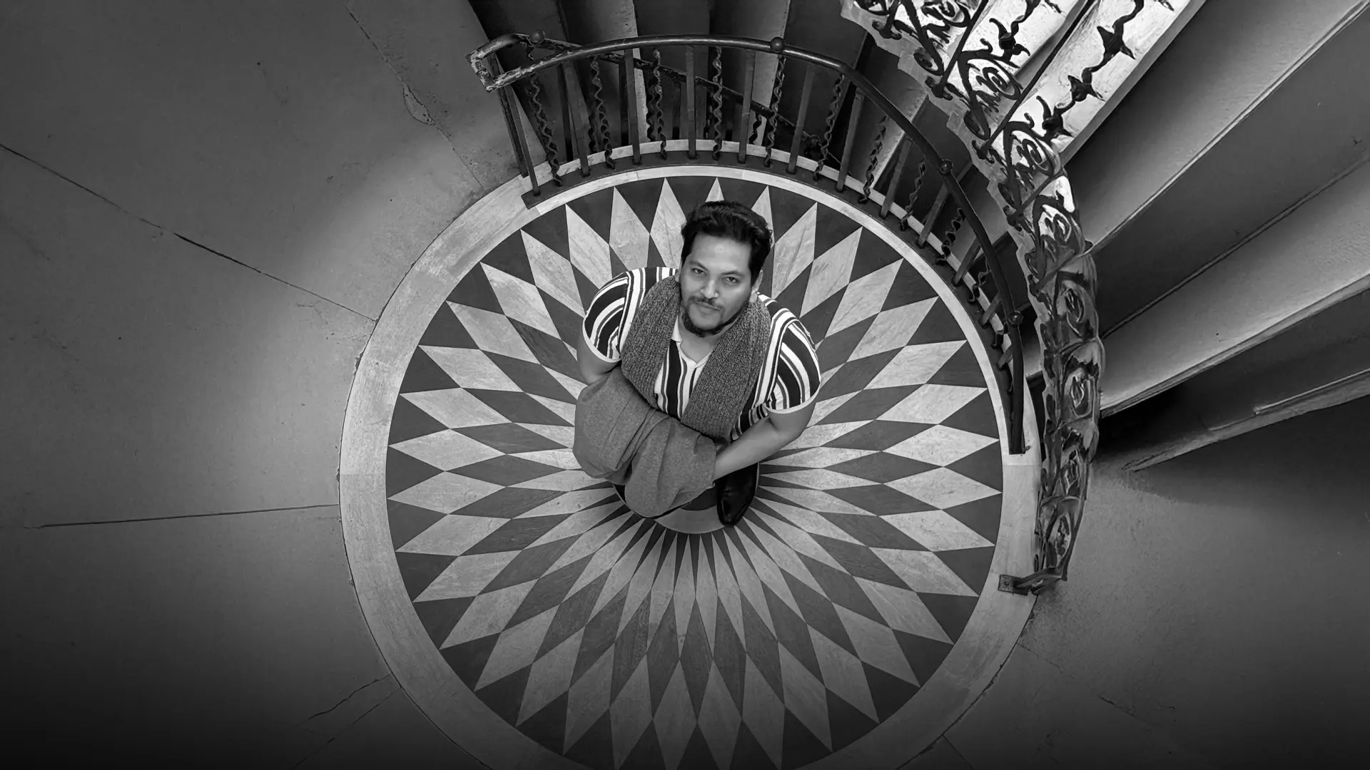 Fardin Fahad seen from above, standing on a patterned floor