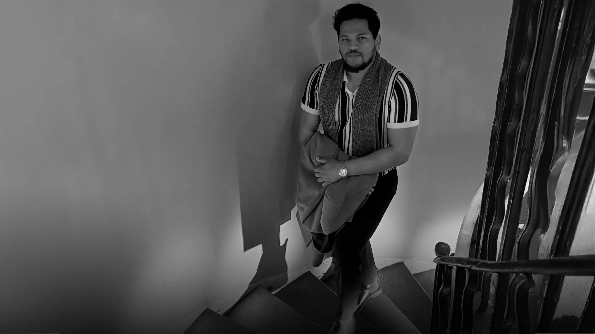 Fardin Fahad on a spiral staircase, black and white